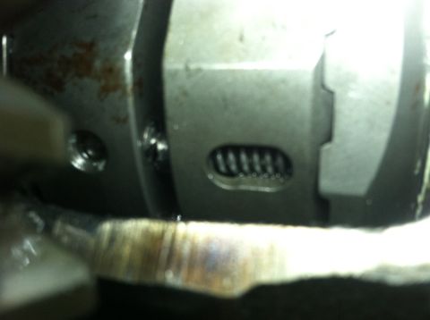 1985 Toyota Pickup/SR5 - Detail of a mechanical component, a visible spring and metal housing.