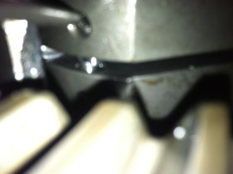 1985 Toyota Pickup/SR5 - Close-up view of internal mechanical components, possibly gears, with a watermark for "SUPERMOTORS" visible.
