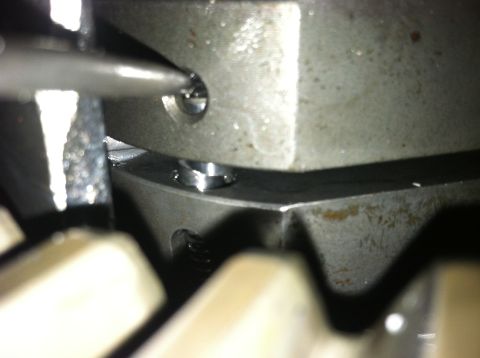 1985 Toyota Pickup/SR5 - Mechanical part detail with a screwdriver being used on a screw.