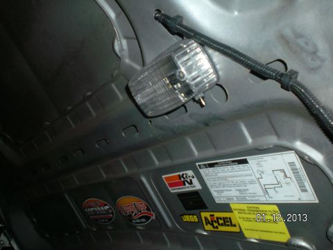 1996 Ford Bronco - Aftermarket hood light with wires run up under hood sheet metal in stock location spliced into stock wiring loom.