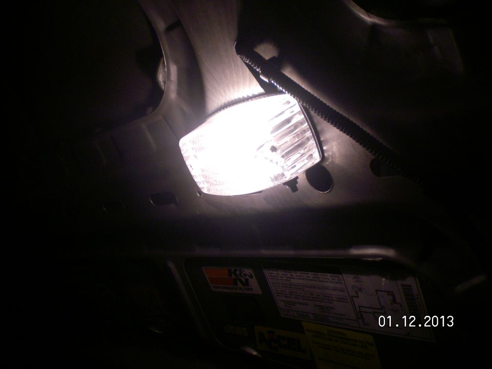 Light is activated with a "push switch" on the back so the hood can be open anytime and not drain the battery!