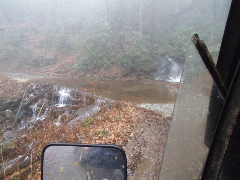 1986 Ford Bronco - View from inside a Ford Bronco as it approaches a stream crossing on a foggy day.