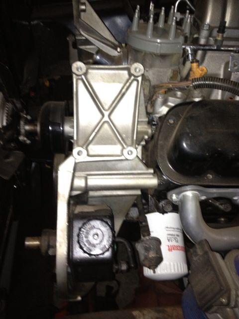 1994 Ford Bronco - Engine part detail, including oil filter and power steering reservoir.