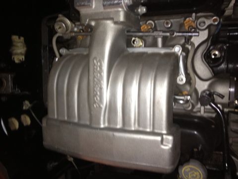 1994 Ford Bronco - Edelbrock intake manifold with fuel system components visible.