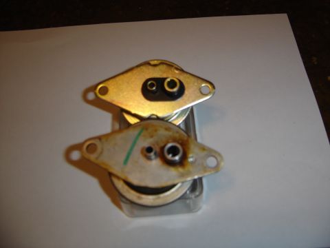 1996 Ford Bronco - Two automotive parts are shown, one above the other, with visible connectors and some wear on the lower part.