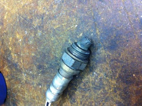 2010 Dodge Challenger - Close-up of an exhaust oxygen sensor, showing wear and damage to the sensor tip.