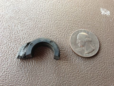 1996 Ford Bronco - A worn rubber component is shown next to a US quarter for scale.