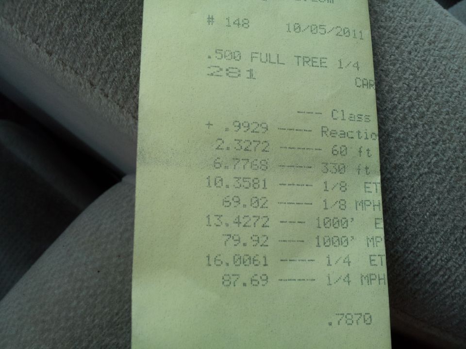 Drag strip time slip document with race data and "SUPERMOTORS" logo at the bottom