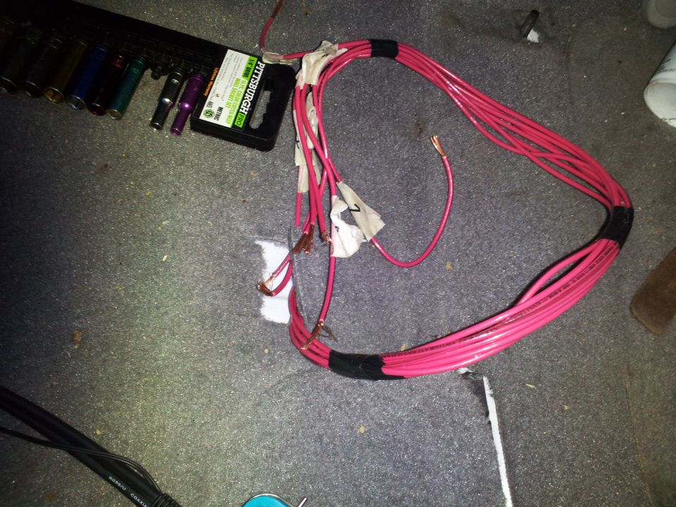 Pink wiring harness and socket set on carpeted floor