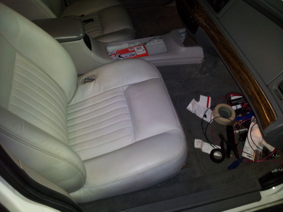 2000 Mercury Grand Marquis interior showing passenger seat, center console, and wiring on the floor