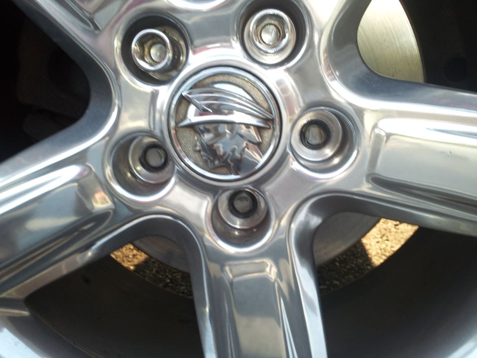 Chrome wheel with Mercury emblem, close-up