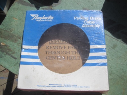 1993 Ford Bronco - A Raybestos parking brake cable assembly is shown in its packaging, with instructions visible through a cutout.