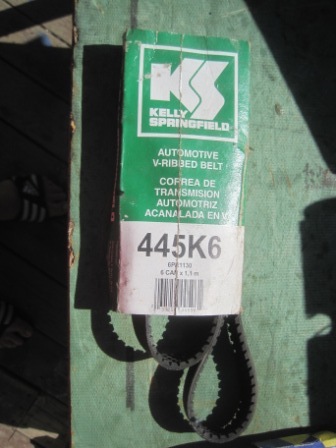 1993 Ford Bronco - A Kelly Springfield automotive V-ribbed belt is shown in its green packaging.
