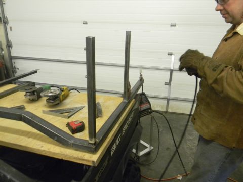 1990 Chevrolet Suburban - Metal fabrication project underway with tools and materials laid out on a workbench.