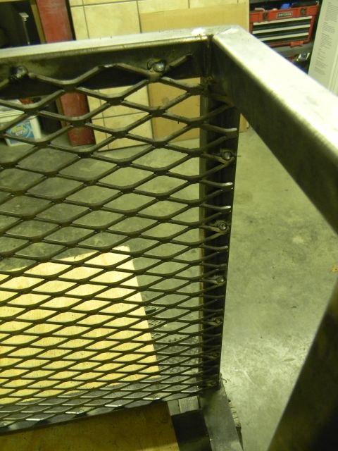 1990 Chevrolet Suburban - Close-up view of a metal grating section, likely part of a larger structure or vehicle component.