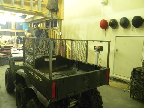 1990 Chevrolet Suburban - Rear view of a 'BIG BOSS' ATV with a metal cargo bed, parked in a garage.