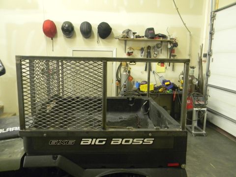 1990 Chevrolet Suburban - This ATV bed has a custom metal cage installed. The side of the bed reads '6x6 BIG BOSS'.