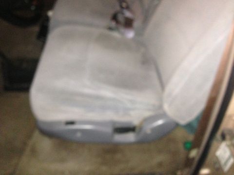 1996 Ford Bronco - Interior view of a car seat with gray fabric and plastic trim.