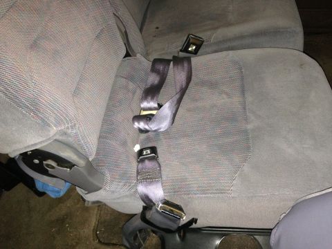 1996 Ford Bronco - Interior view of car seats with seatbelts fastened.