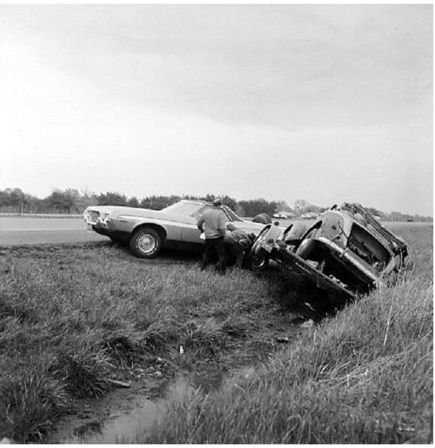 1971 Ford Ranchero and another car wrecked in a grassy ditch
