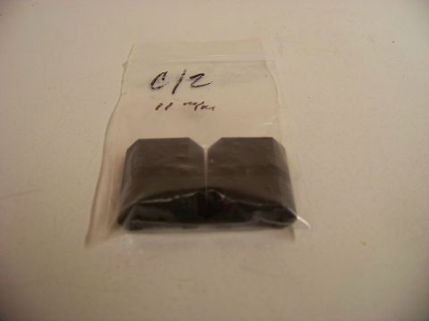 1995 Mercury Grand Marquis - Two black rubber parts are shown inside a plastic bag with handwritten markings.