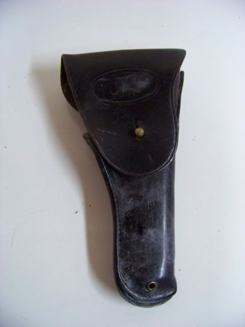 1995 Mercury Grand Marquis - Leather holster with oval US marking and brass stud closure.