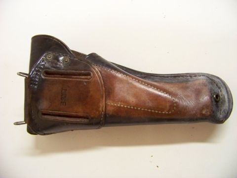 1995 Mercury Grand Marquis - A vintage leather holster, possibly for a firearm, is shown against a plain background.