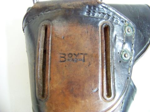 1995 Mercury Grand Marquis - Close-up of a leather holster showing stamped markings 'BOYT' and '4-13-1'.