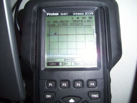 1993 Ford Probe - A Protek S2401 Universal SCOPE diagnostic tool displays waveforms on its screen.