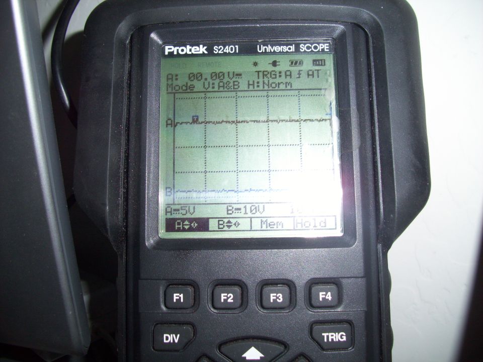 Protek S2401 Universal SCOPE diagnostic tool screen showing waveforms