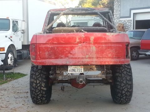 1978 Ford Bronco - This 1978 Ford Bronco is heavily modified for off-road use, a prominent roll cage and lifted suspension.
