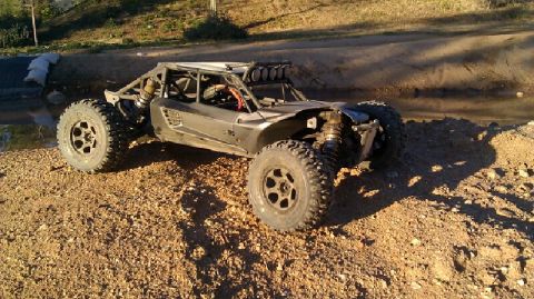 1996 Ford Bronco - This remote control buggy has a roll cage and large off-road tires.