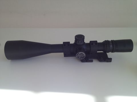 2013 Ford Mustang - A black rifle scope is shown from the side on a white surface.