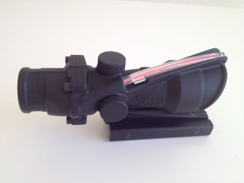 2013 Ford Mustang - A Trijicon ACOG scope is shown from the side, mounted on a rail.