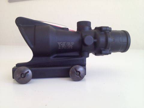 2013 Ford Mustang - This Trijicon ACOG scope is shown from the side, with visible text and mounting hardware.