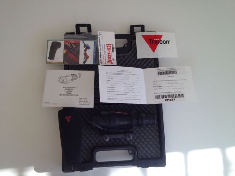 2013 Ford Mustang - Contents of a Trijicon ACOG scope case, including manuals and accessories.