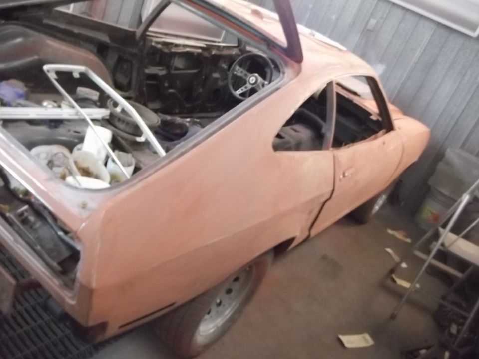 1978 Ford Mustang II interior and bodywork, stripped down for restoration. Steering wheel and dashboard visible