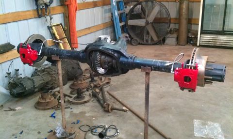 1995 Ford Bronco - Front axle assembly with disc brakes and differential housing, likely for a Ford truck or SUV.