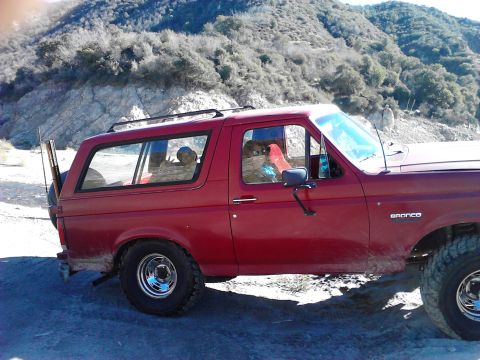 1988 Ford Bronco - This 1988 Ford Bronco is seen in a dry, hilly landscape, with its spare tire mounted on the back.