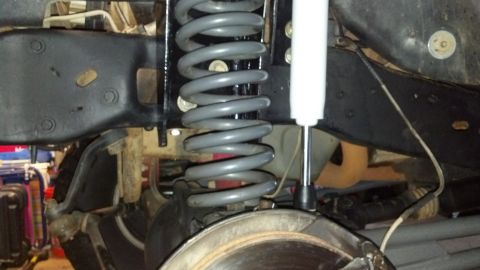 1992 Ford Bronco - Suspension components including a coil spring and shock absorber are visible in this close-up view.