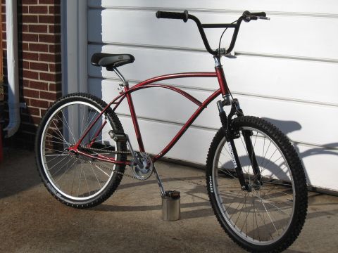 1994 Ford Bronco - A custom cruiser bicycle with a unique frame design is shown parked outdoors.