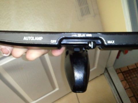 1994 Ford Bronco - Close-up of an auto lamp control switch, showing settings for OFF, DELAY, and MAX.