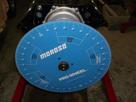 1965 Shelby Cobra - A blue Moroso Pro-Wheel degree wheel is positioned on an engine block, likely for timing adjustments.