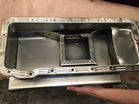1965 Shelby Cobra - This image shows an oil pan with internal baffles and a square sump, likely a performance or aftermarket part.