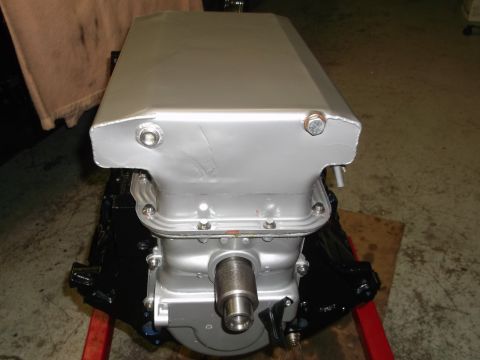 1965 Shelby Cobra - A silver engine oil pan is shown, mounted on an engine stand. The registry claims it is from a 1965 Shelby Cobra, but this is unconfirmed.