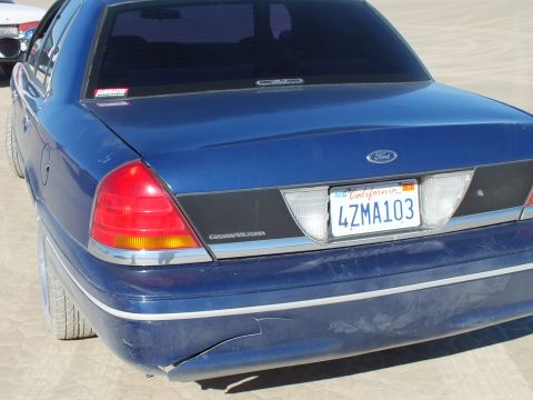 2003 Ford Crown Victoria - Close rear shot of a blue Crown Victoria showing its trunk badge and California plate 4ZMA103.