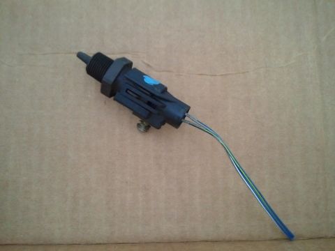 1994 Ford Bronco - This is an automotive sensor with a black plastic housing and three wires attached.