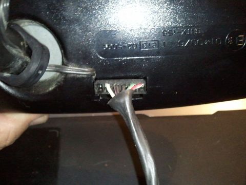 1994 Ford Bronco - Close-up of a rear view mirror wiring harness, showing the connector and exposed wires.