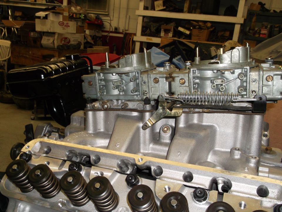 Engine with dual carburetors and valve springs