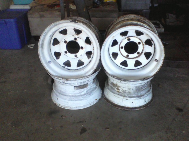 two white steel wheels stacked